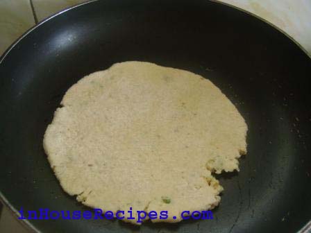 Add the rolled flat bread to the heated pan